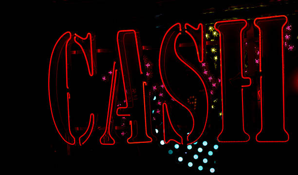 istock Neon light displaying the words cash in red 529162381