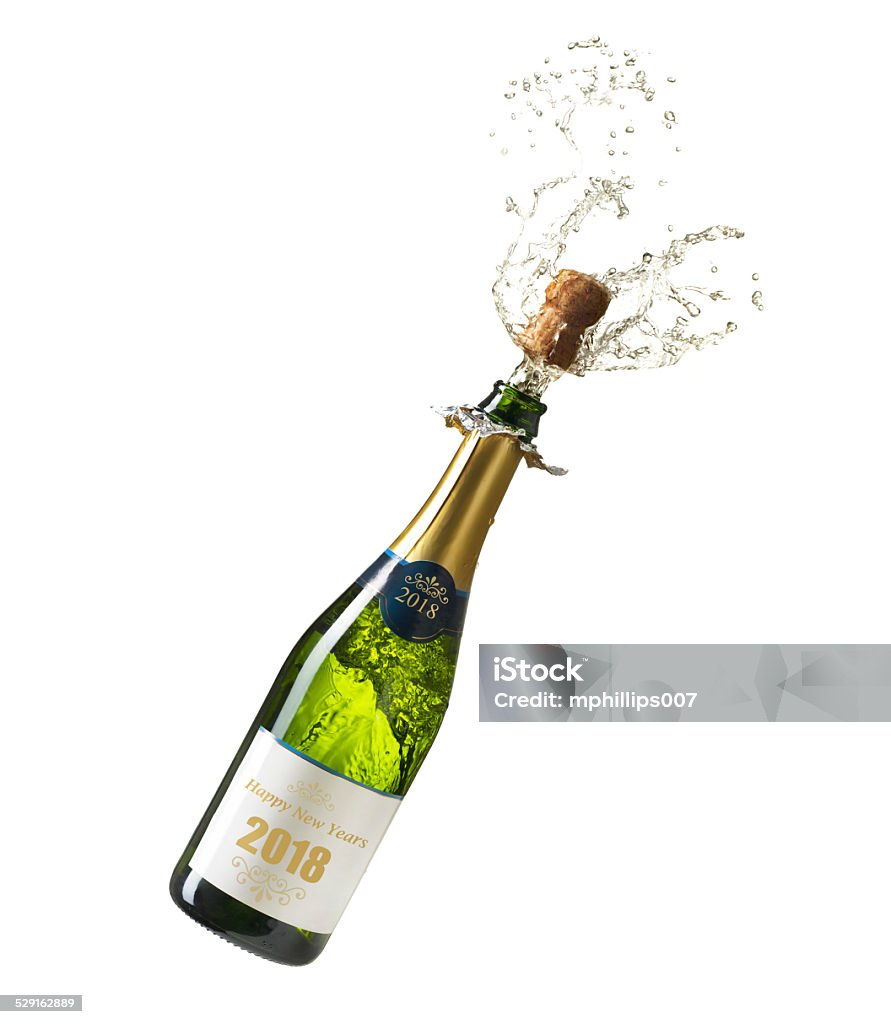 Champagne New Years 2018 Champagne bottle exploding for New Years with the words "Happy New Years 2018" printed on the label.  Please see my portfolio for other food and drink images. Champagne Stock Photo