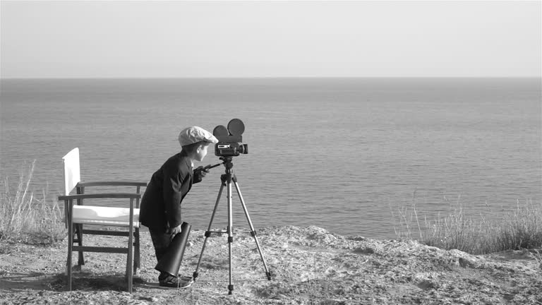 Slow motion Video Of Little Film Director Filming In Outdoor Set