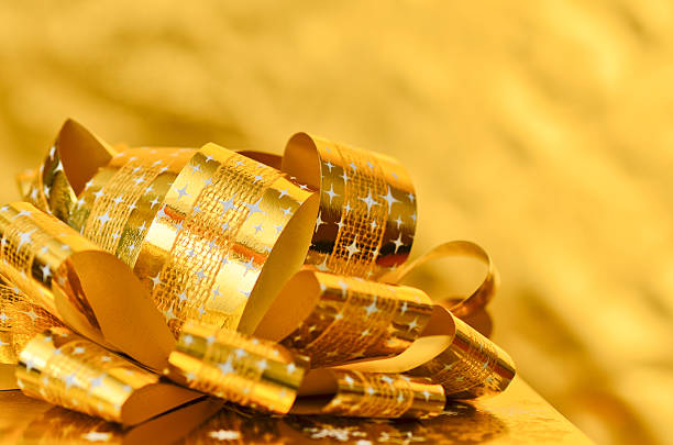 istock Golden gift box with gold ribbon. 529175505