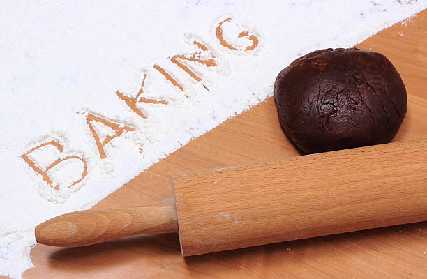 Word baking written in flour and dough for gingerbread