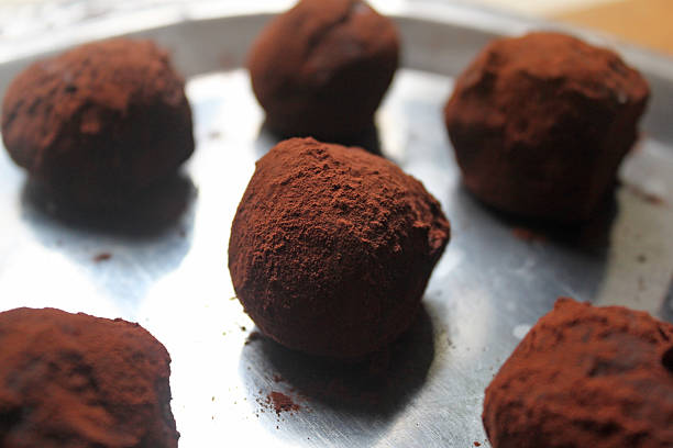 istock Group of chocolate truffles on silver plate. 529181507
