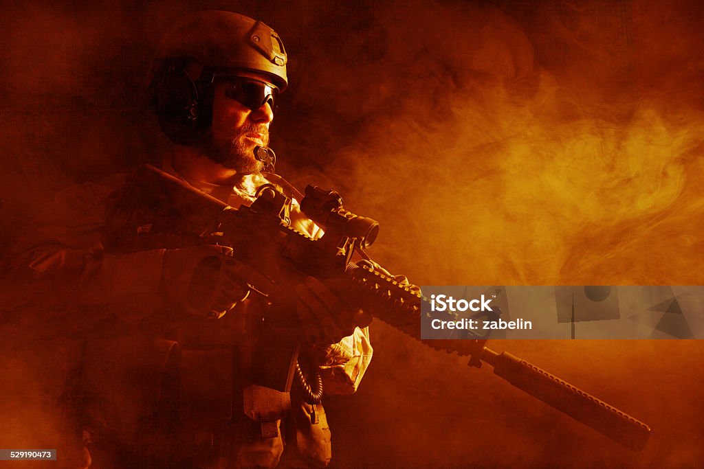 Bearded special forces soldier Bearded special forces soldier in the fire Armed Forces Stock Photo