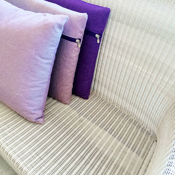 istock Purple cushions decorating rattan sofa 529193405