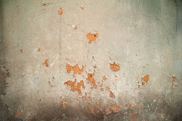istock Texture of old wall covered with gray stucco 529196615
