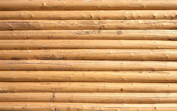 istock Wall of a house from planed horizontal logs as background 529196741