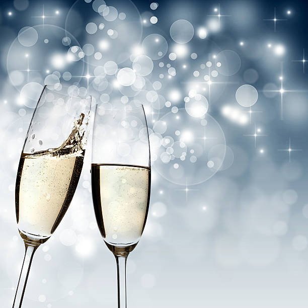istock Toasting with champagne glasses on sparkling holiday background 529197185