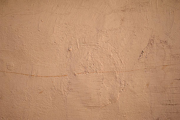 istock Texture of old wall covered with brown stucco 529198109