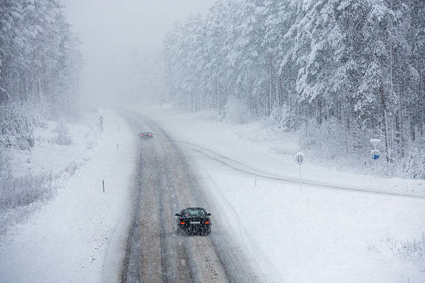 istock Car driving on snow road 529209055