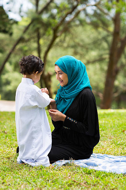 istock arabian mother playing with her baby boy 529209611