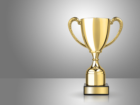champion golden trophy on gray background
