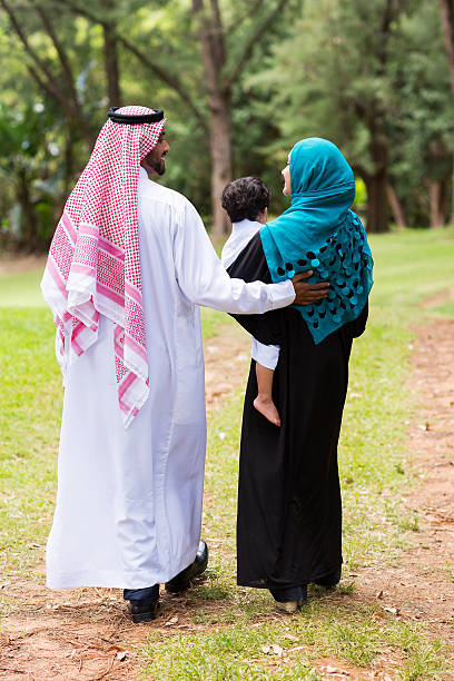 istock middle eastern family walking at the park 529210317