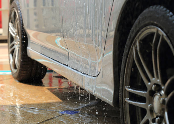 istock car wash with water and foam cleaning 529211233