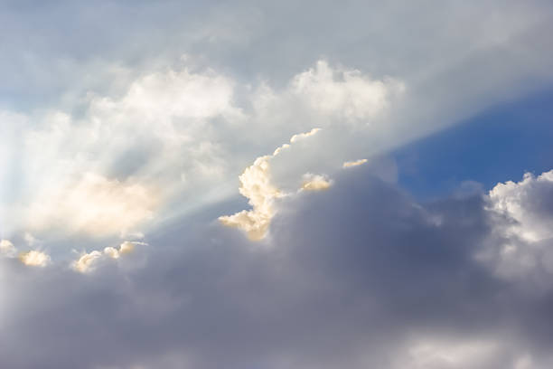 istock Ray of lights sunbeams break through thick clouds 529211309