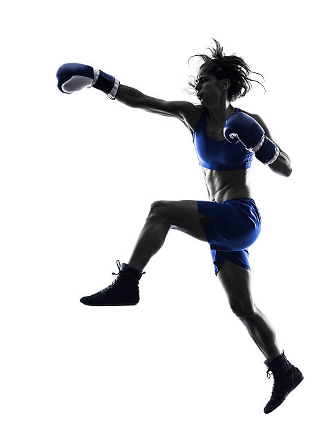 istock woman boxer boxing kickboxing silhouette isolated 529219841