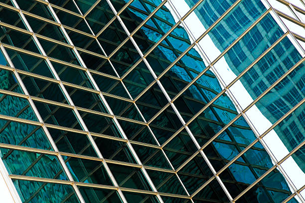 istock Modern office architectur at blue glass wall backgrounds 529220375