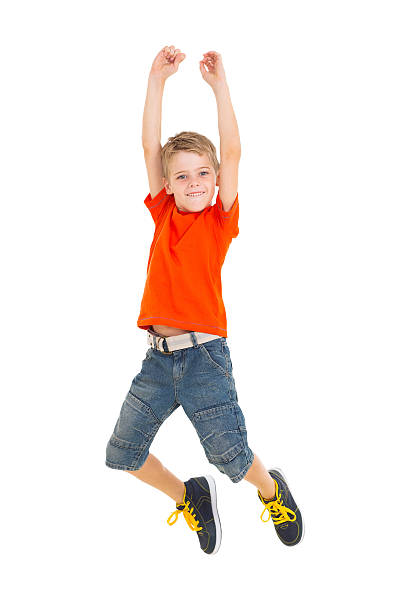 alegre rapaz saltar - fashion model small one person happiness imagens e fotografias de stock
