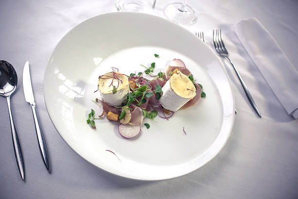 istock Goat cheese gratin, served with Serrano ham and marinated pumpkin 529223531