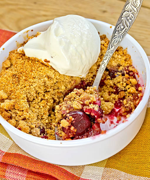 istock Crumble cherry in bowl with ice cream on napkin 529224609