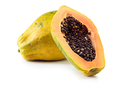 Studio shot of papaya fruit against a white background