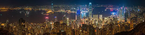 Photo of Hong Kong golden city illuminated skyscrapers and harbour night China