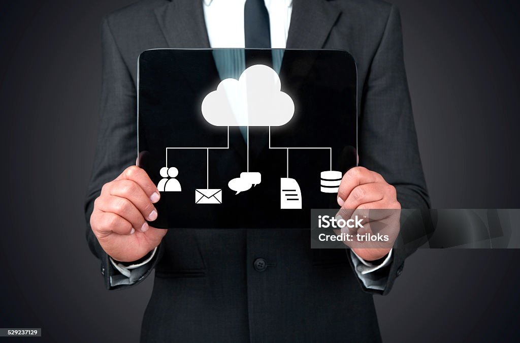 Cloud computing concept Hands holding transparent tabletHands holding transparent tablet Adult Stock Photo