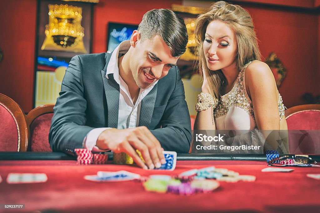 Poker player Poker player looking cards Casino Stock Photo