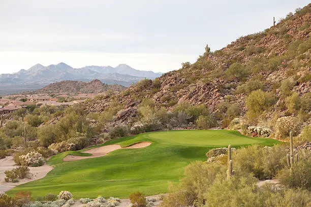 A beautiful desert golf course. Phoenix, Arizona. The American Southwest is one of the hottest golf destinations in the world. Millions of people flock to The Valley of the Sun to play golf each winter. Snowbirds from Canada, especially, are popular visitors! This golf course, routed through a beautiful natural desert with cacti and boulders, is located near Phoenix. 