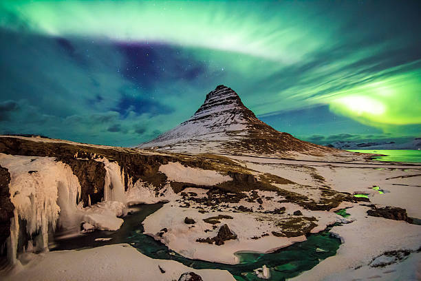 Spectacular celestial lights Aurora Borealis above Kirjuffell, Iceland stock photo