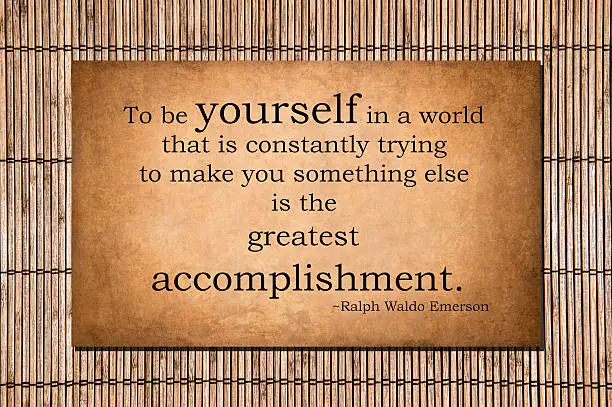 To be yourself in a world that is constantly trying to make you something else is the greatest accomplishment. Ralph Waldo Emerson's quote over bamboo.