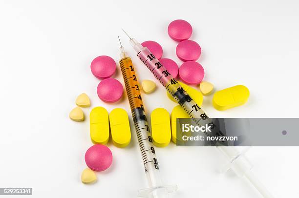 Insulin Needles On Pills And Tablets Stock Photo - Download Image Now - Addiction, Antibiotic, Assistance