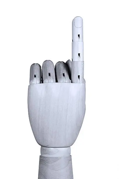 Wooden model hand showing one finger up with back of the hand be seen