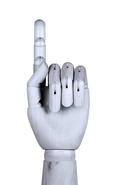 Wooden model hand showing one finger up with palm be seen