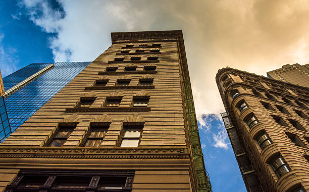 istock Looking up at office buildings in downtown Boston, Massachusetts 529254069