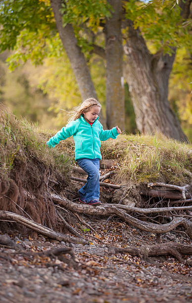 istock Girl Walking Down Riverbank 529254805