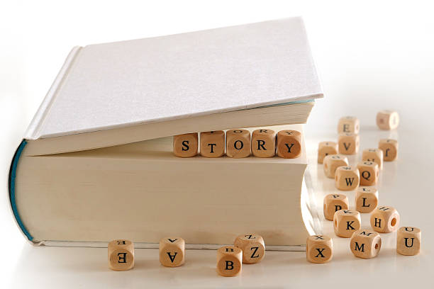 istock story - message with letter blocks between book pages 529255945