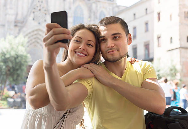 istock Couple doing selfie at the street 529272817