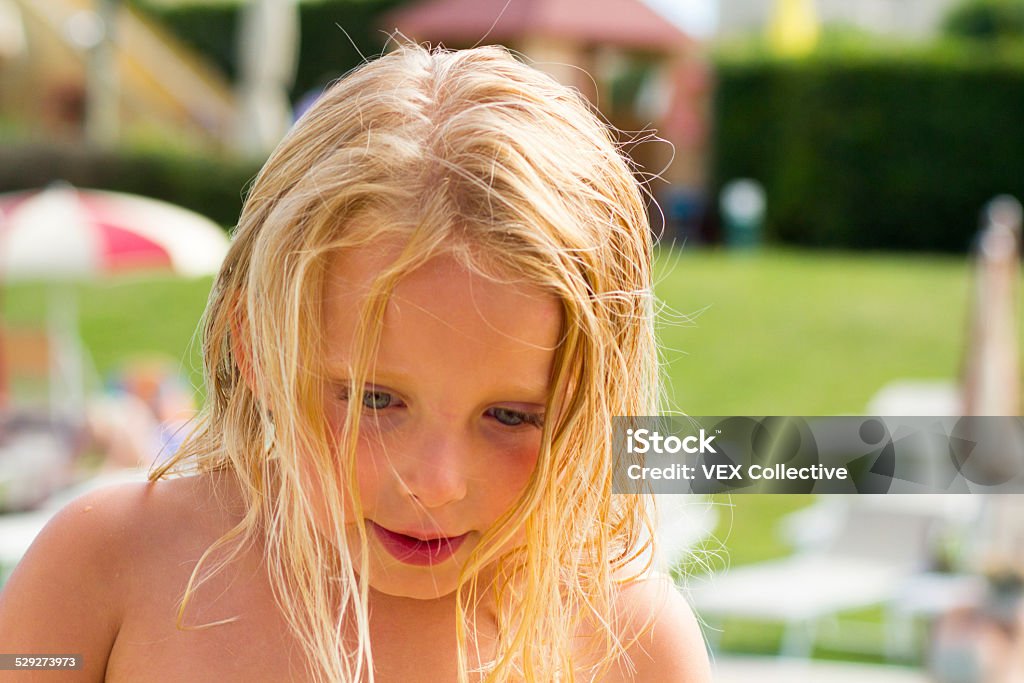 blonde girl in the marina pool A blonde 6 year old in teh marina swimming pool,old marble pillars and the harbor in the background. Venice, Italy 6-7 Years Stock Photo