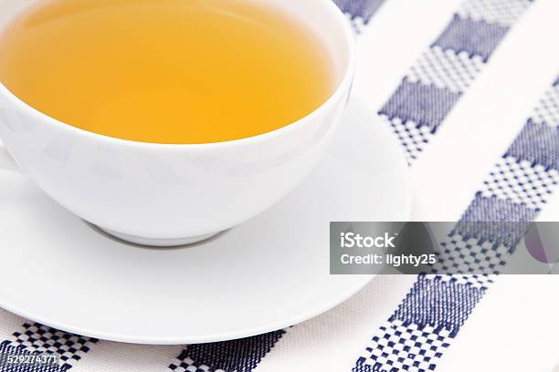 Cup Of Chamomile Tea On Checkered Tablecloth Stock Photo - Download Image Now - Chamomile, Chamomile Tea, Cup