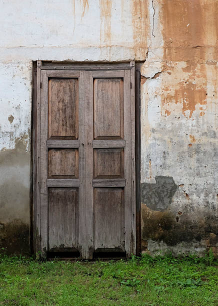 istock Old wall with door-building 529275369