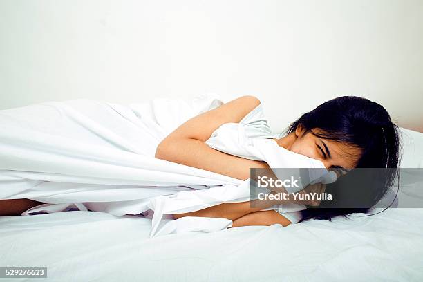 Pretty Indian Brunette In Bed Smiling White Sheets Stock Photo - Download Image Now