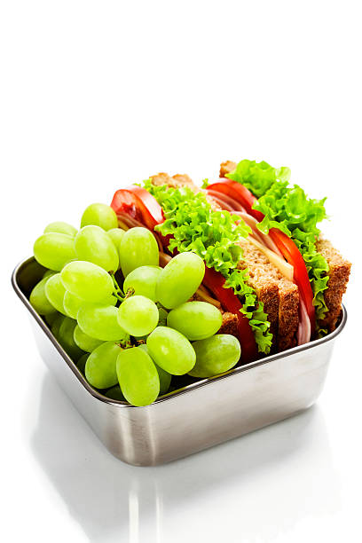 istock Lunch box with sandwich and grapes 529278065