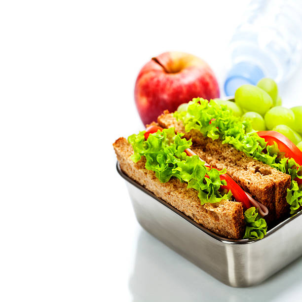 istock Lunch box with sandwiches and fruits 529278081