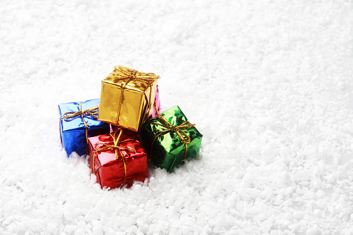 The small gift box group on snow for decoration christmas events