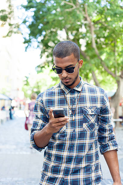 istock African male sending a text message during his lunch break. 529313655