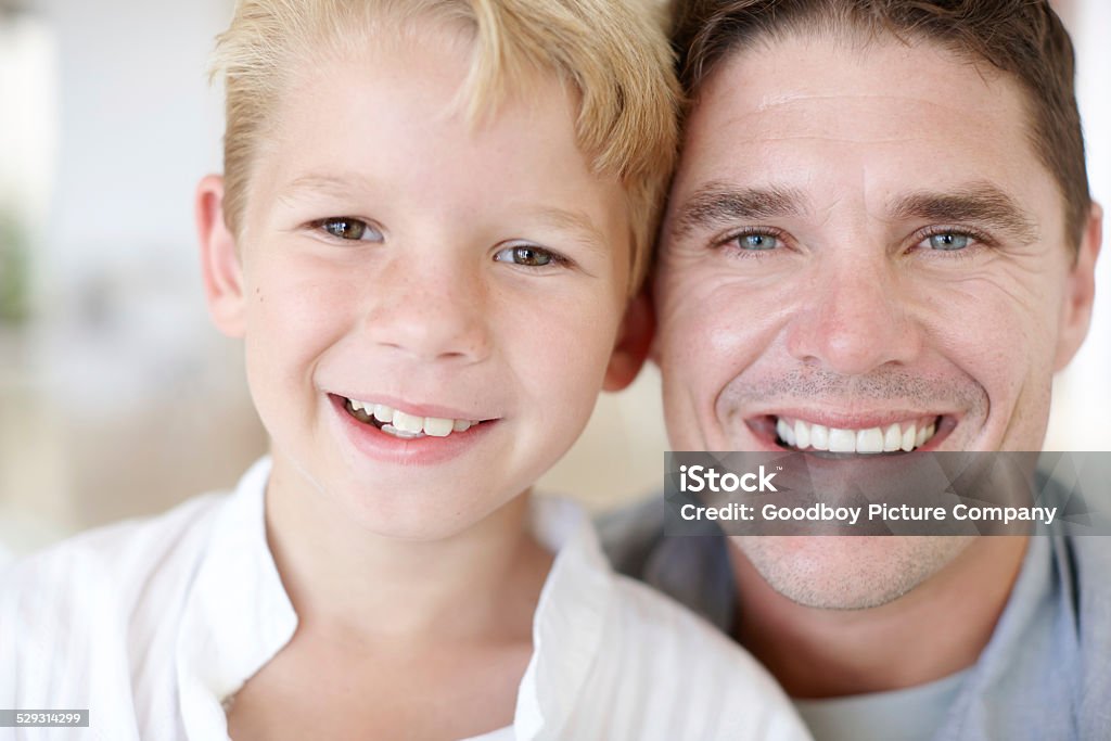 So proud of my little man Cropped portrait of a handsome young man sitting on the sofa with his son Adult Stock Photo