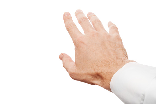 Right business man hand trying to grab something, first-person view photo with selective focus isolated on white background