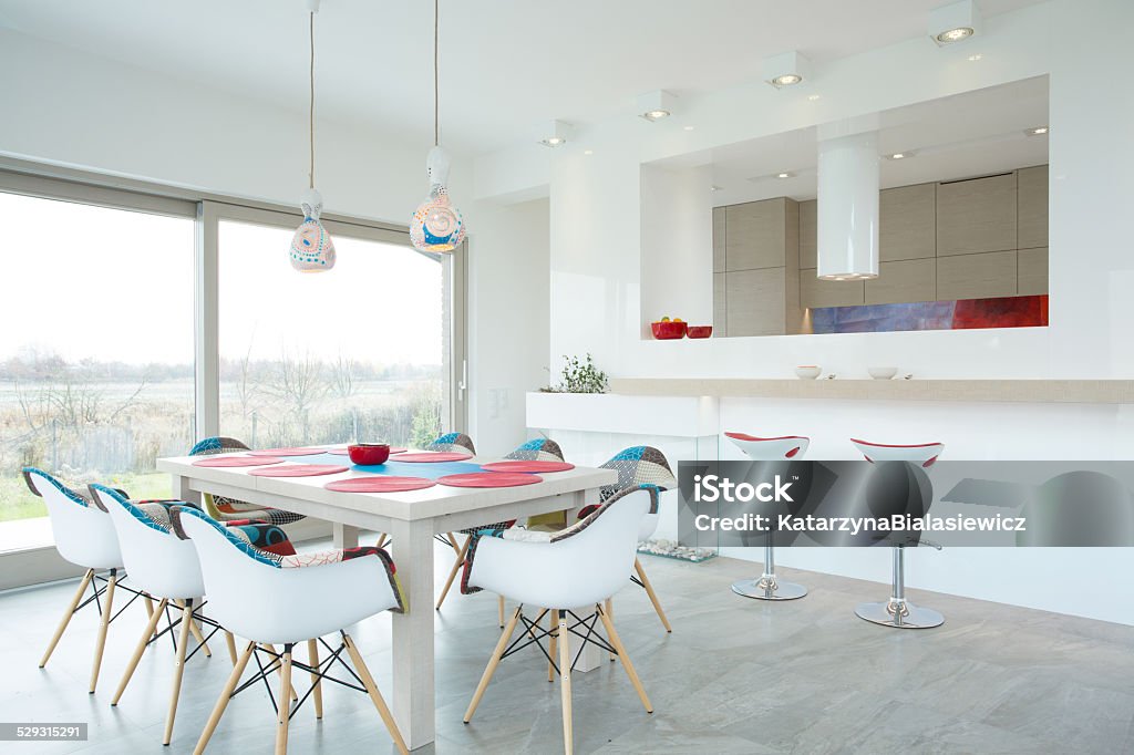 Dining room with color elements Modern dining room interior with color elements Apartment Stock Photo