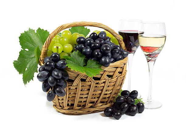istock Fresh Grapes in Wicker Basket and Wine Glass Cups Isolated 529315363