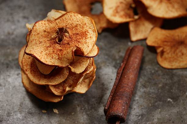 Apple Cinnamon Chips Baked apple chips cinnamon photos stock pictures, royalty-free photos & images